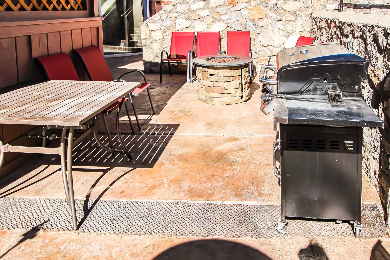 A BBQ grill area with bonfire pit at VRI's Crown Point Condominiums in New Mexico.